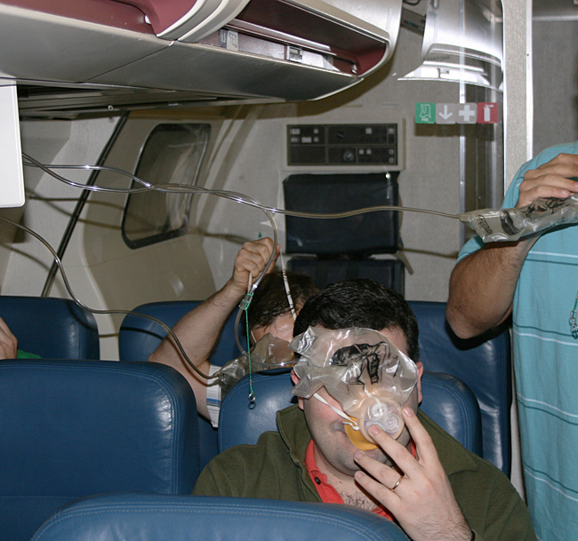 I hope you will never have to put on oxygen masks in the unlikely event of an emergency; but these “passengers” are having fun. Photograph ©2013 by Brian Cohen.