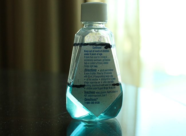 This small bottle can fit two doses of mouthwash, as indicated by the black lines drawn on it. I realize that it will not win the award for most aesthetically pleasing bottle design of the year — but it works for me. I would tell you to ignore the expiration date on the bottle in the photograph; but that would probably only encourage you more to look at it anyway. Photograph ©2014 by Brian Cohen.