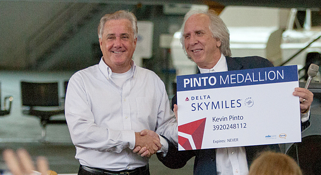 Randy Petersen honors Kevin Pinto with “Pinto Medallion ‘lifetime’ status” which is guaranteed never to expire at an event which honored Kevin on March 18, 2013. Photograph ©2013 by Greg Johnston.