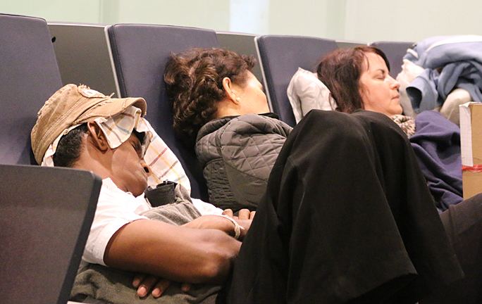 People sleeping airport Abu Dhabi