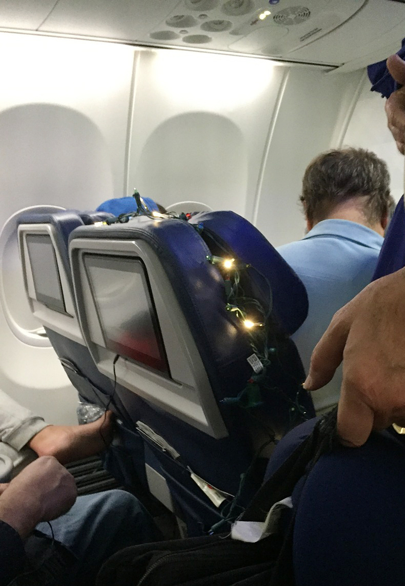 Christmas lights around airplane seat
