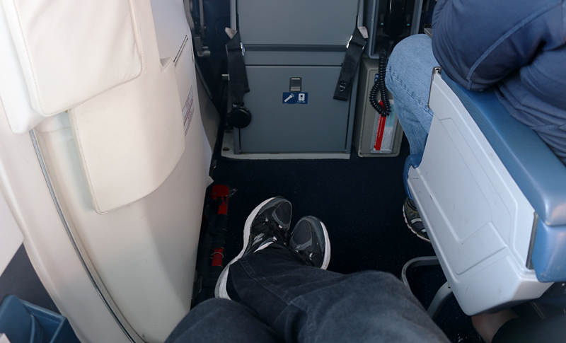 Exit row seat extra legroom rear of MD-88 airplane