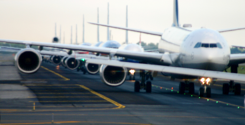 Airplanes Lined Up on Runway