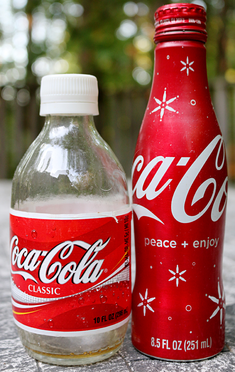 Glass bottle and aluminum bottle of Coca-Cola