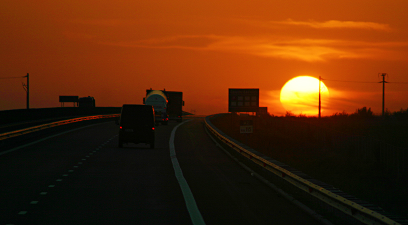 Sunset over highway in Romania