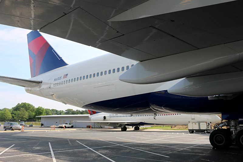 Boeing 747-451 Next to a McDonnell Douglas DC-9-51 Delta Air Lines