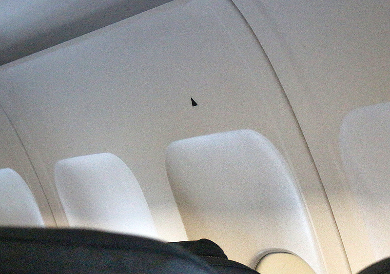 black triangles airplane window