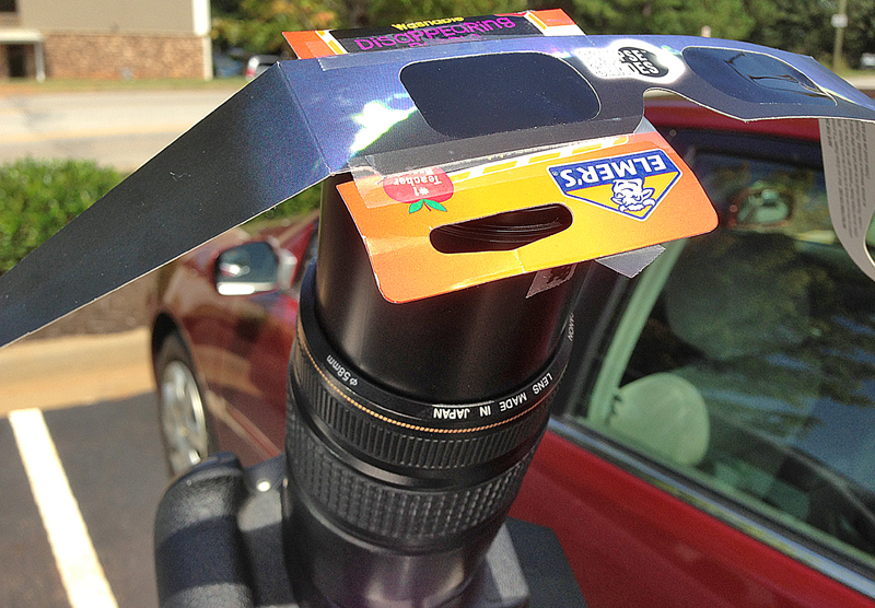 Solar eclipse glasses on lens