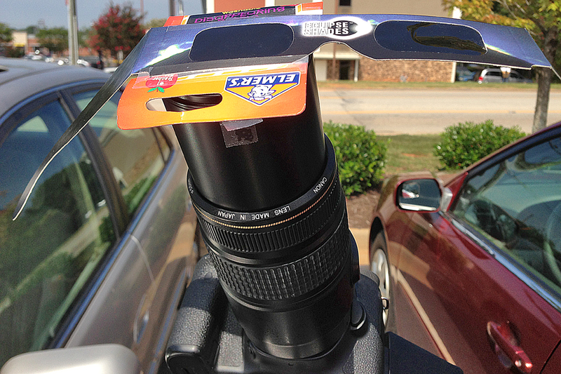 Solar eclipse glasses on lens