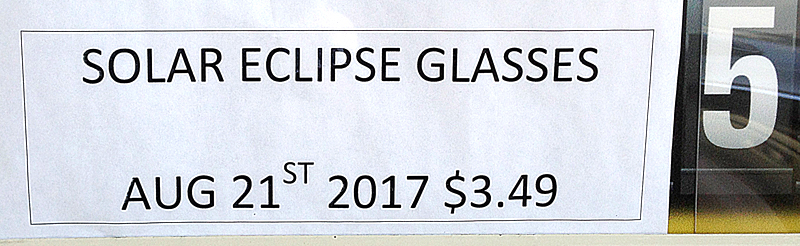 Solar eclipse sign at gasoline station